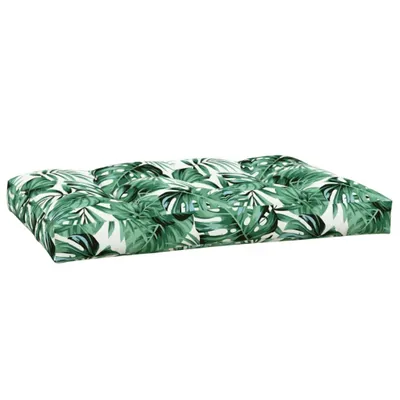 A green and white leaf-patterned cushion on a white background.
