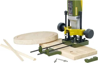 A woodworking tool and accessories are arranged on a wooden surface.