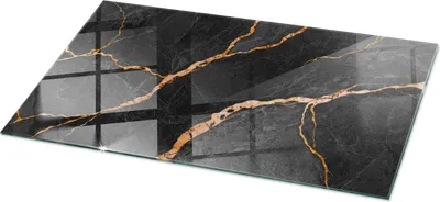 A rectangular glass cutting board with a black marble pattern and gold veins, presented on a white background.