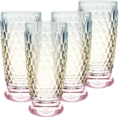 A set of four tall, clear glasses with a textured, honeycomb-like pattern and a pink base, arranged diagonally.