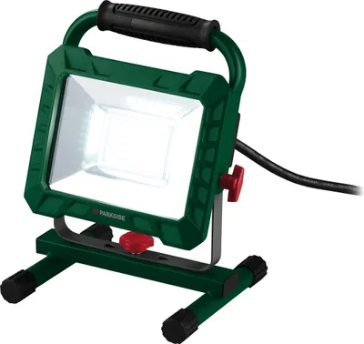 A studio shot of a green LED work light on a white background.