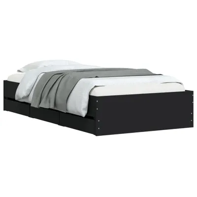 A black bed frame with drawers, shown from the side with white and gray bedding.