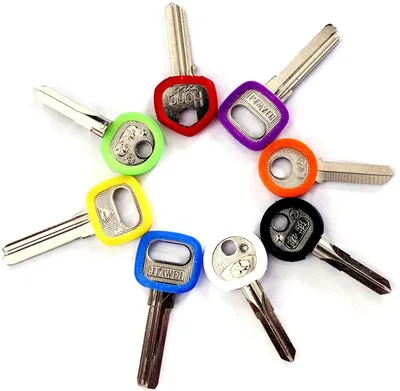 A collection of colorful key caps arranged in a circular pattern on a white background.