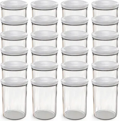 A grid of clear glass jars with white lids.