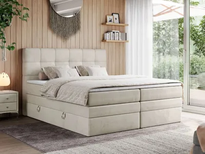A bedroom scene with a bed, nightstand, and decor.