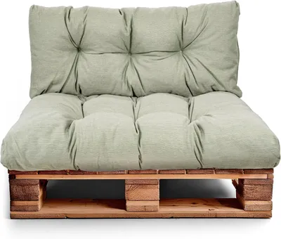 A cushion set on a wooden pallet.