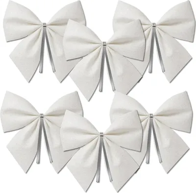 A set of six white bows with silver accents, arranged on a white background.