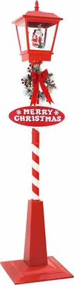 A red Christmas street lamp with a lantern, wreath, and a 'Merry Christmas' sign, standing on a white background.