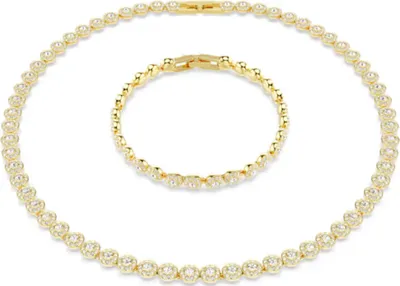 A gold necklace and bracelet set with clear stones, displayed on a white background.