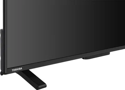Close-up of the bottom part of a black Toshiba TV on a white background.