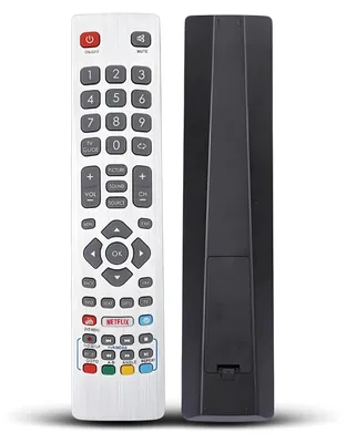 A white remote control is shown next to its black back cover, both on a white background.