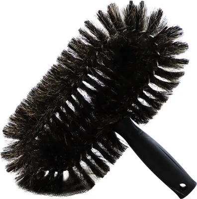 A black and brown duster brush with a black handle, isolated on a white background.