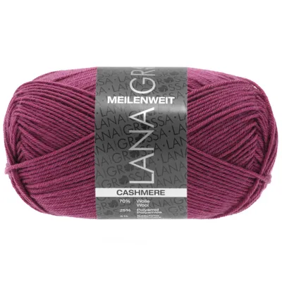 A ball of fuchsia-colored yarn with a label.