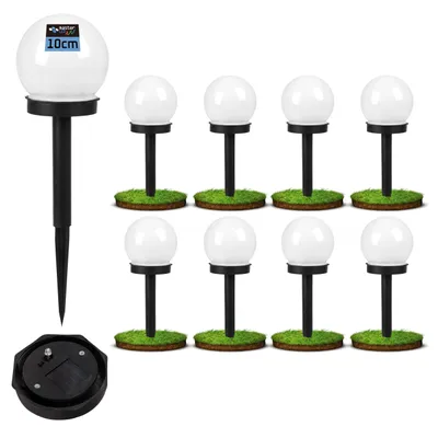 A set of eight white globe-shaped solar garden lights with black stakes, displayed on a white background with a hint of green grass at the base of each light.