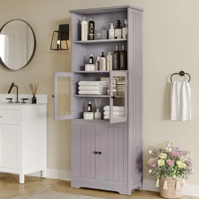 A bathroom scene with a tall cabinet, sink, and mirror.