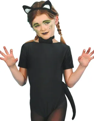 A young girl wearing a black cat costume, including ears, a bow tie, and a tail, with face paint.