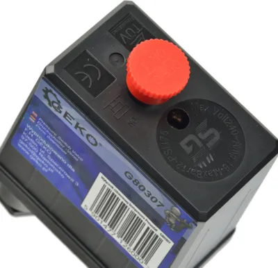 A close-up, angled view of a black pressure switch for an air compressor, set against a white background.