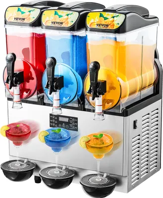 A commercial slushie machine with three dispensers, filled with red, blue, and yellow drinks. Three glasses of slushies are shown in front of the machine.