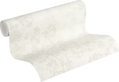 A roll of wallpaper with a floral pattern.