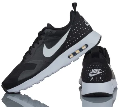 A pair of black Nike Air Max Tavas sneakers are shown against a white background.