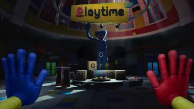 A first-person perspective of a room with a large blue toy character in the center, holding a sign that says "Playtime". There are also large letter blocks spelling "HUGGY".
