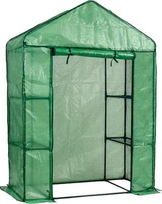 A green greenhouse with shelves inside, shown from the front with the opening visible.