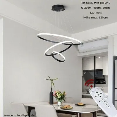 A modern dining room with a chandelier and a remote control.