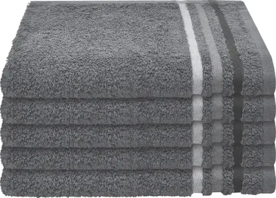 A stack of five dark gray towels with subtle striped accents on the edges.