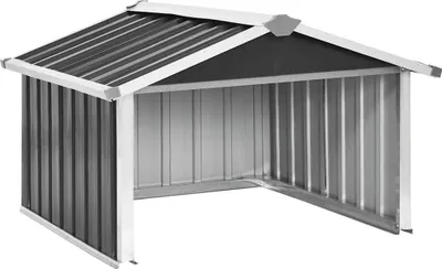 A metal shed for storing a lawnmower.