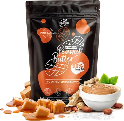Immagine prodotto di Nustino - Burro di arachidi in polvere al caramello salato 400 g - 90% di grassi in meno - Ricco di proteine - Senza zucchero - A basso contenuto di grassi - Senza olio di palma - Ideale per la pasticceria