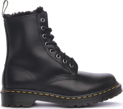 A black Dr. Martens boot with fur lining.