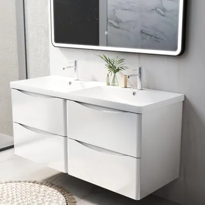 A modern bathroom vanity with a double sink and drawers, mounted on the wall.