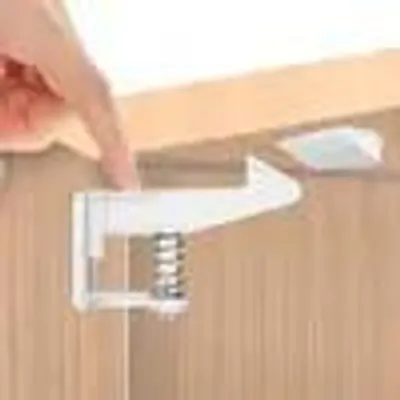 Produktbild von Kindersicherung Baby - Unsichtbar, Weiß, Selbstklebend (3M), Edelstahl, 10er Set für Schränke & Schubladen - Ohne Bohren, Einhandzugriff für Erwachsene