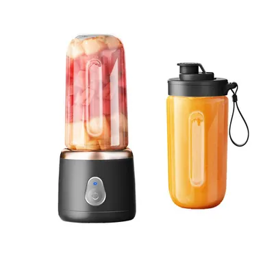 A portable blender and a travel cup are displayed against a white background.