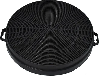 A black circular carbon filter for a range hood.