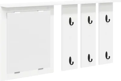 A white wall-mounted coat rack with a shelf and a cabinet door.