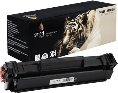 A black toner cartridge is shown in the foreground, with its packaging box in the background. The box features a graphic of a tiger and branding.