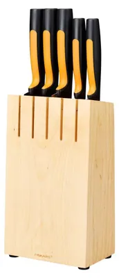 A set of knives in a wooden block.