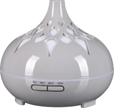 A gray aroma diffuser with a decorative patterned top.