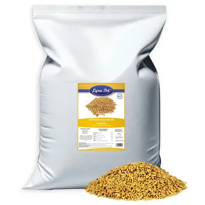 A large white bag of birdseed with a label and a pile of birdseed in front of it.