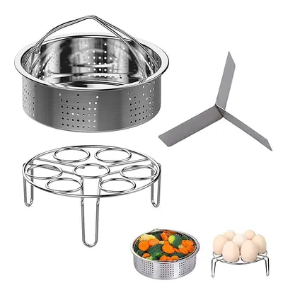 A collection of stainless steel kitchen accessories for a pressure cooker, including a steamer basket, an egg rack, and a trivet.