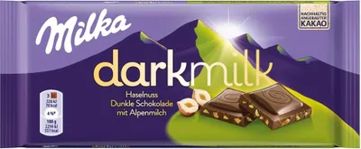 A Milka darkmilk chocolate bar with hazelnuts.