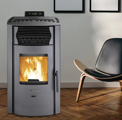A pellet stove is shown in a living room setting next to a modern chair.