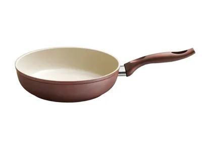 A brown and cream ceramic frying pan with a brown handle is shown against a white background.