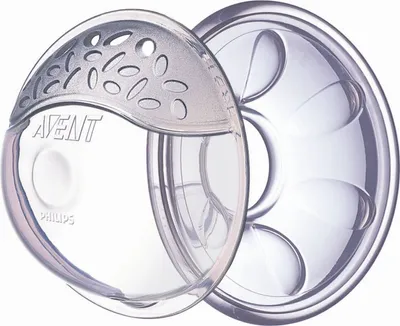 Two Avent breast shells are shown against a white background. The shell on the left has a textured gray top with oval-shaped openings and the Avent and Philips logos. The shell on the right is clear with internal molded shapes.
