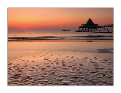 Produktbild von Wallario Herdabdeckplatte aus Glas, Größe 70 x 52 cm 2-teilig, Motiv Strand am Abend - Seebrücke am Ostseebad Heringsdorf