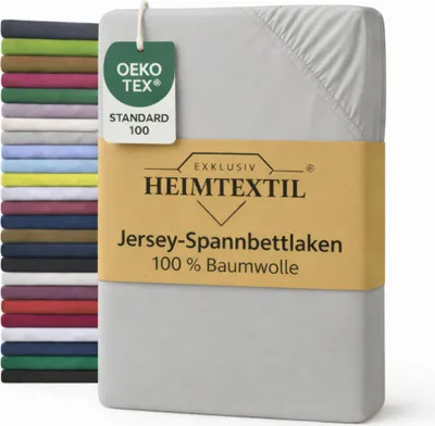A stack of folded bedsheets in various colors is shown next to a single gray bedsheet with product information and certifications.