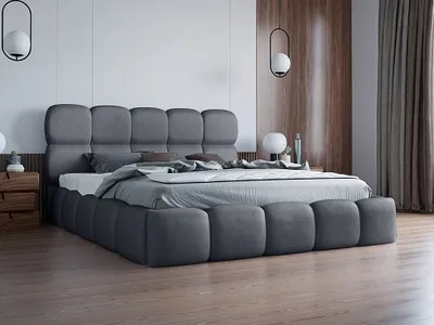 A modern bedroom with a large upholstered bed.