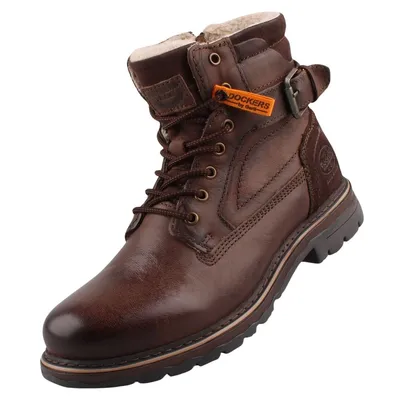 Das Bild zeigt einen braunen Stiefel der von der Seite betrachtet wird. Der Stiefel hat eine robuste Sohle und eine hohe Schaftform die ihm ein elegantes Aussehen verleiht.