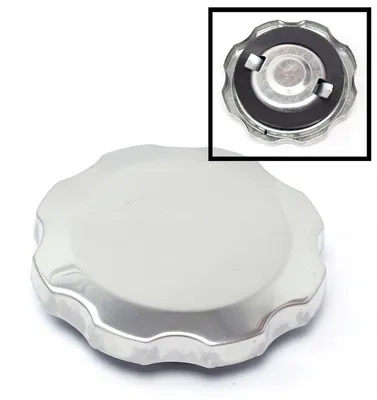 A silver cap with a black rubber seal, shown from a top-down perspective with a close-up inset.